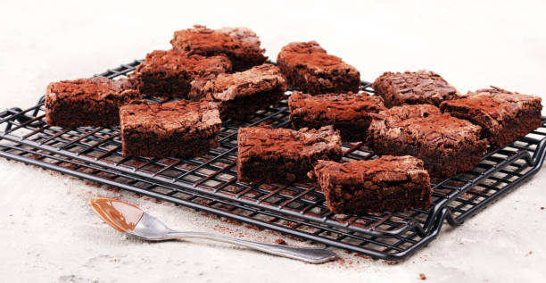 istock homemade chocolate brownies on rustic table. brownie bakery. 934885008