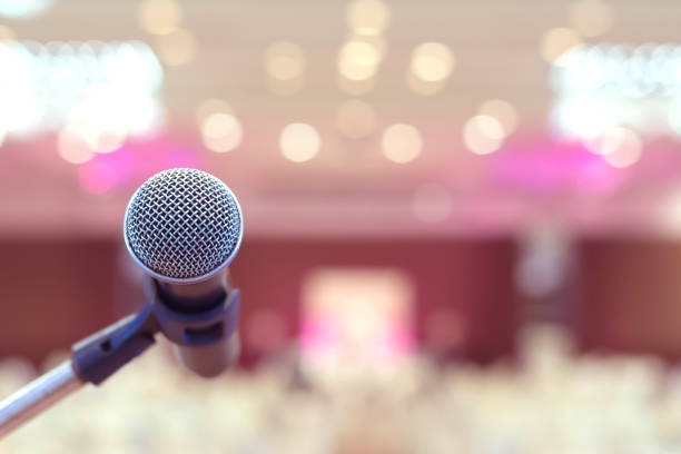 istock Microphone in conference on seminar room event background 934887168