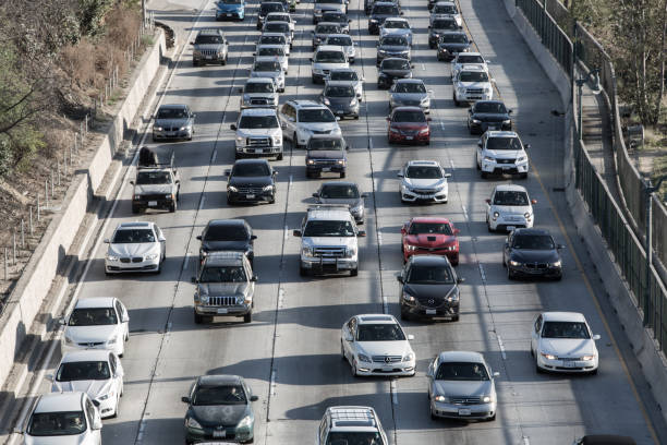 istock Los Angeles skyline with freeway traffic and signs 934889804