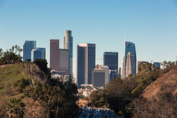 istock Los Angeles skyline with freeway traffic and signs 934889898