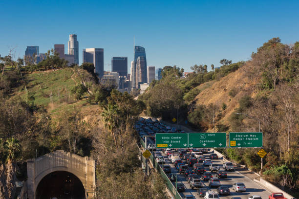 istock Los Angeles skyline with freeway traffic and signs 934890348