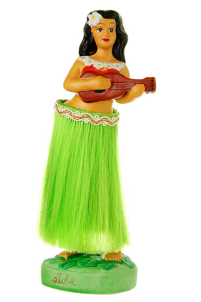 A dashboard hula girl for a car Dashboard hula girl doll isolated on white. hula dancer stock pictures, royalty-free photos & images