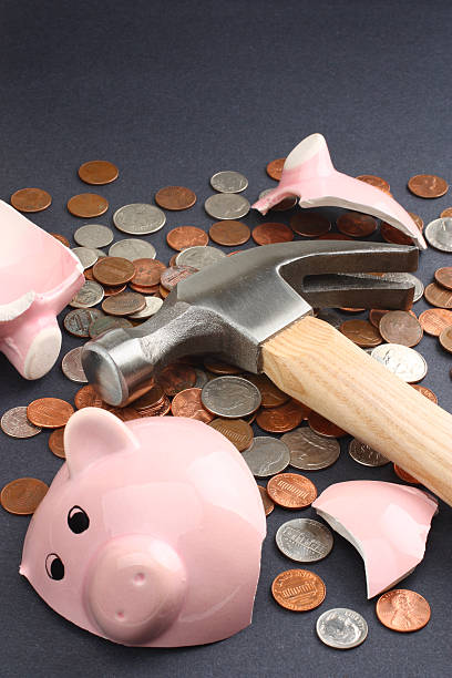 istock Breaking a Piggy Bank 93489590
