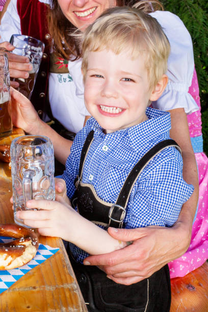 istock young bavarian boy with family at beergarden 934900698
