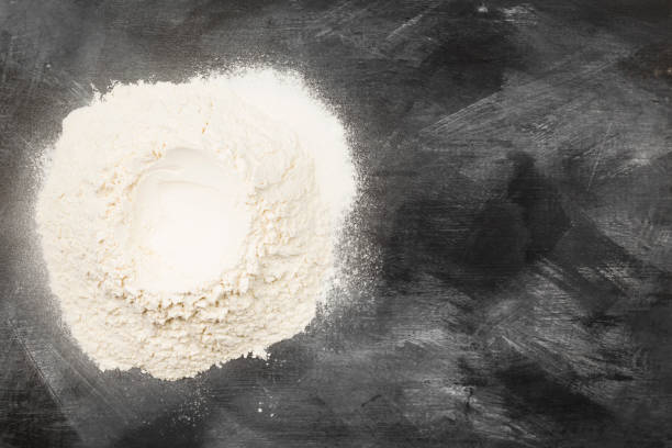 istock Flour on dark background. Top view, copy space. Food background 934903192