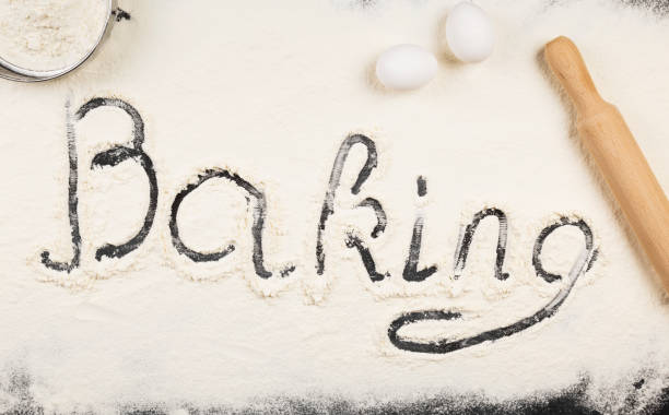 istock Ingredients for pastries (flour, eggs) and rolling pin dark background. Top view, copy space. Food background 934903206