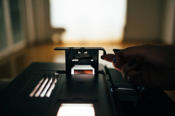 istock Close up of slide projector in the dark room 934903430