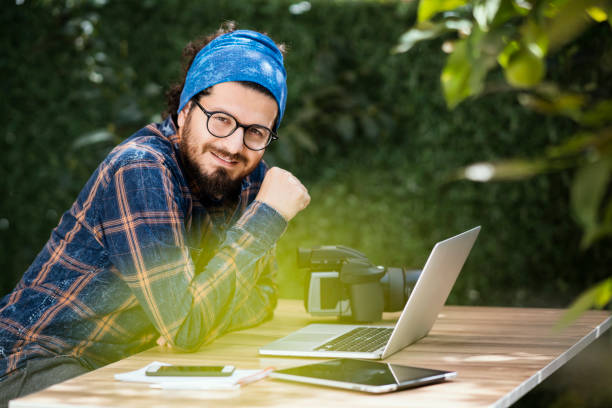 istock Photographer working on laptop, outdoors 934903756