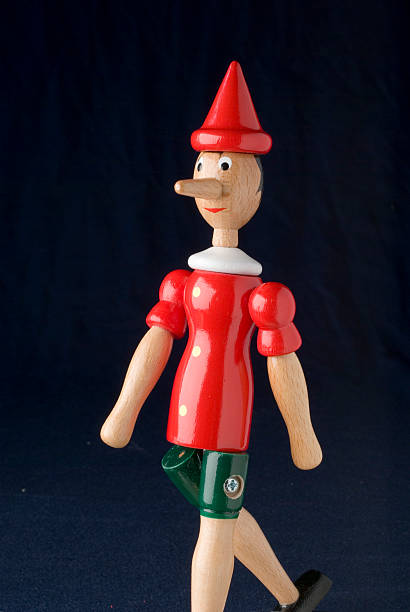 Pinocchio walking, with clipping path stock photo
