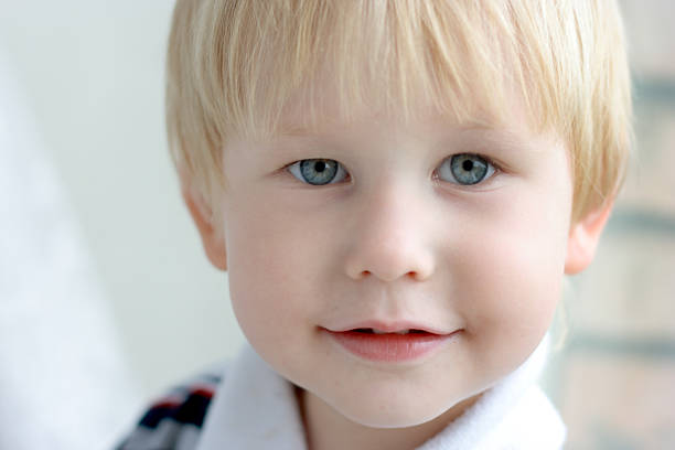 istock child with blond hair and blue eyes 93490624