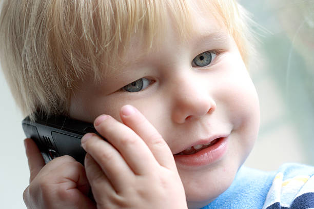 istock child speaks on the telephone 93490643
