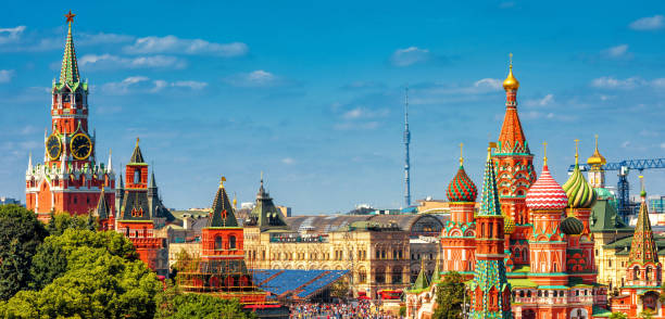 Panoramic view of the Red Square in Moscow, Russia Panoramic view of the Red Square with Moscow Kremlin and St Basil's Cathedral in summer, Moscow, Russia. It is the best-known sights of Moscow. Beautiful panorama of the heart of sunny Moscow. kremlin stock pictures, royalty-free photos & images