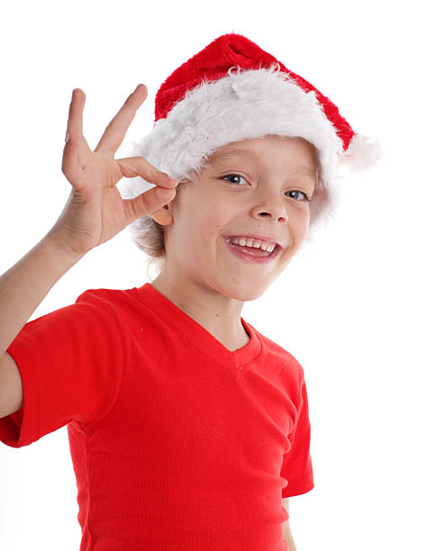 istock Happy child in christmas hat 93491174