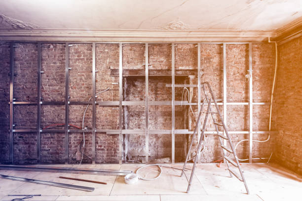 istock Frames for plasterboard for making gypsum walls on the brick wall in an apartment is under construction, remodeling, renovation,  restoration, reconstruction 934919136
