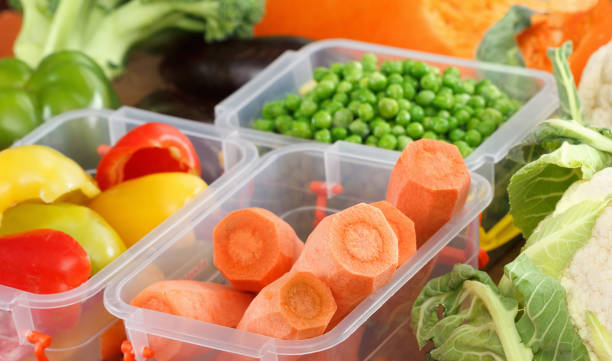 istock Trays with raw vegetables for freezing. 934922260