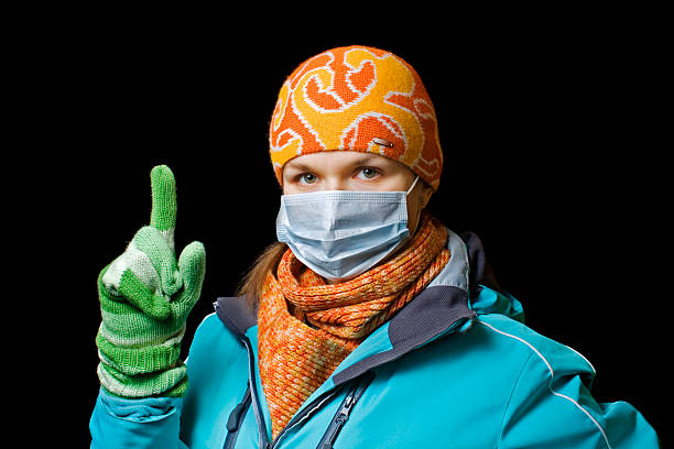 girl in a mask to protect against influenza stock photo