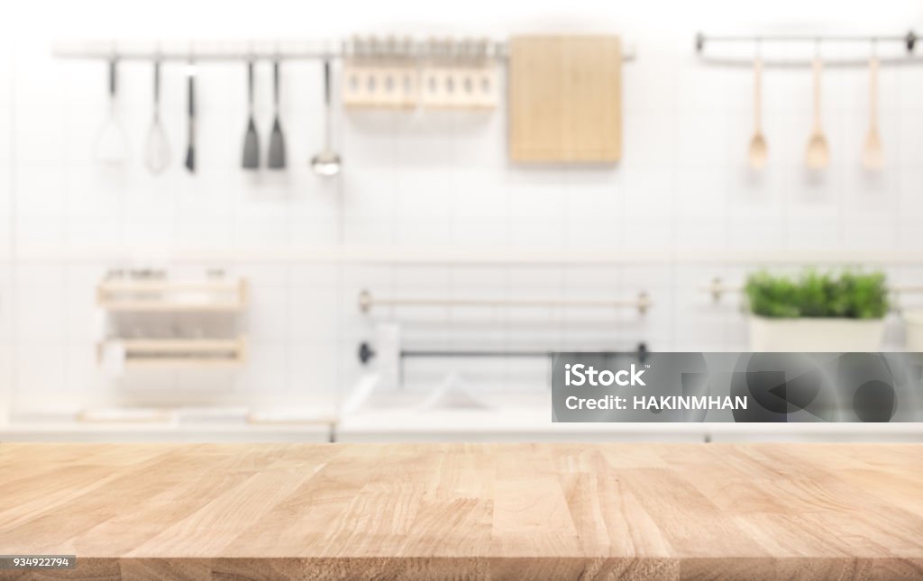 Wood table top on blur kitchen room background Wood table top on blur kitchen room background .For montage product display or design key visual layout. Kitchen Stock Photo