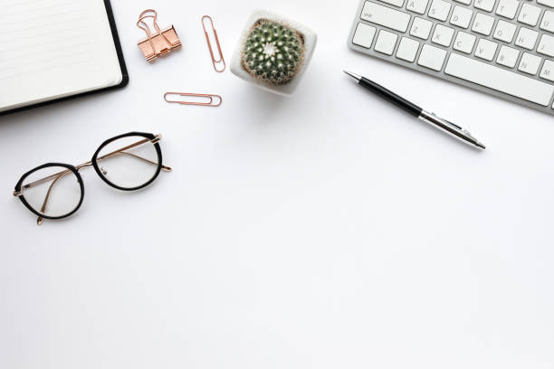 istock Business table top with mock up office supplies on white background.Flat lay design. 934927352