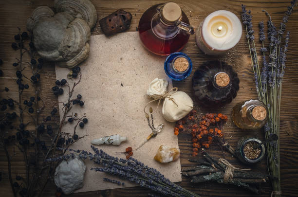 istock Magic potion ancient recipe scroll with copy space. Alternative herbal medicine. Shaman table with copy space. Druidism concept. Herbal medicine. 934933542