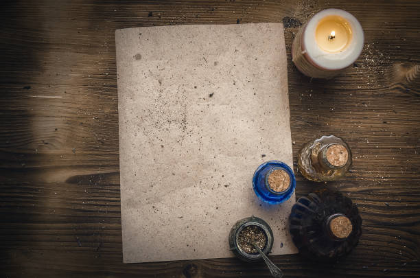 istock Magic potion ancient recipe scroll with copy space. Alternative herbal medicine. Shaman table with copy space. Druidism concept. Herbal medicine. 934938440
