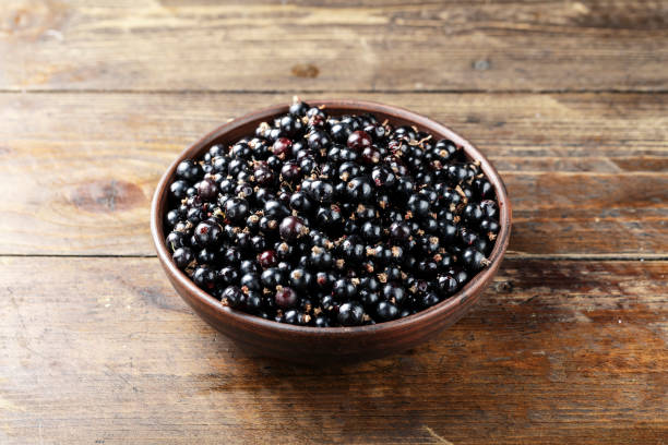 istock natural antioxidant fresh organic currant on a wooden background 934939880