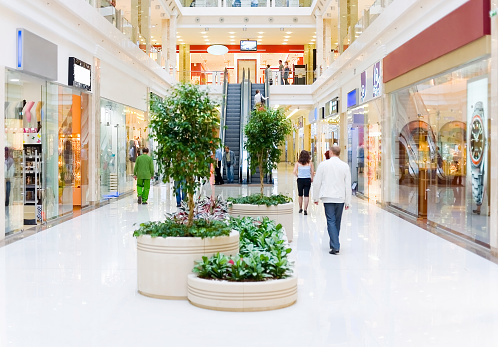 Shopping hall #4. Motion blur. Focus on escalator