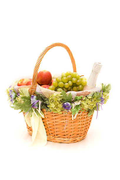 cesto di frutta con bottiglia di champagne su bianco - gift apple ribbon fruit foto e immagini stock