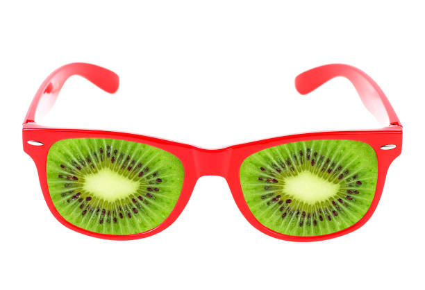istock Beach sunglasses concept with kiwi fruit on white background 934957222