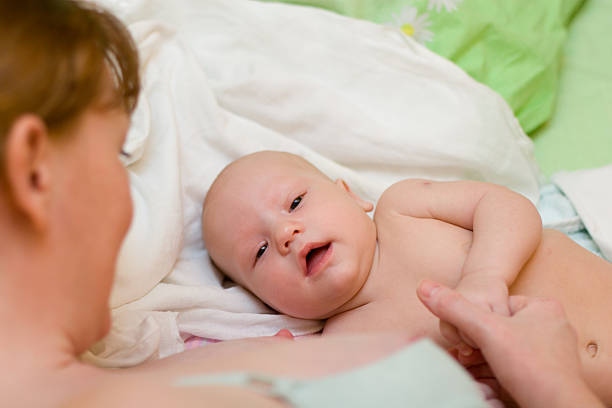 istock Mother and baby relaxing in the bed 93495780