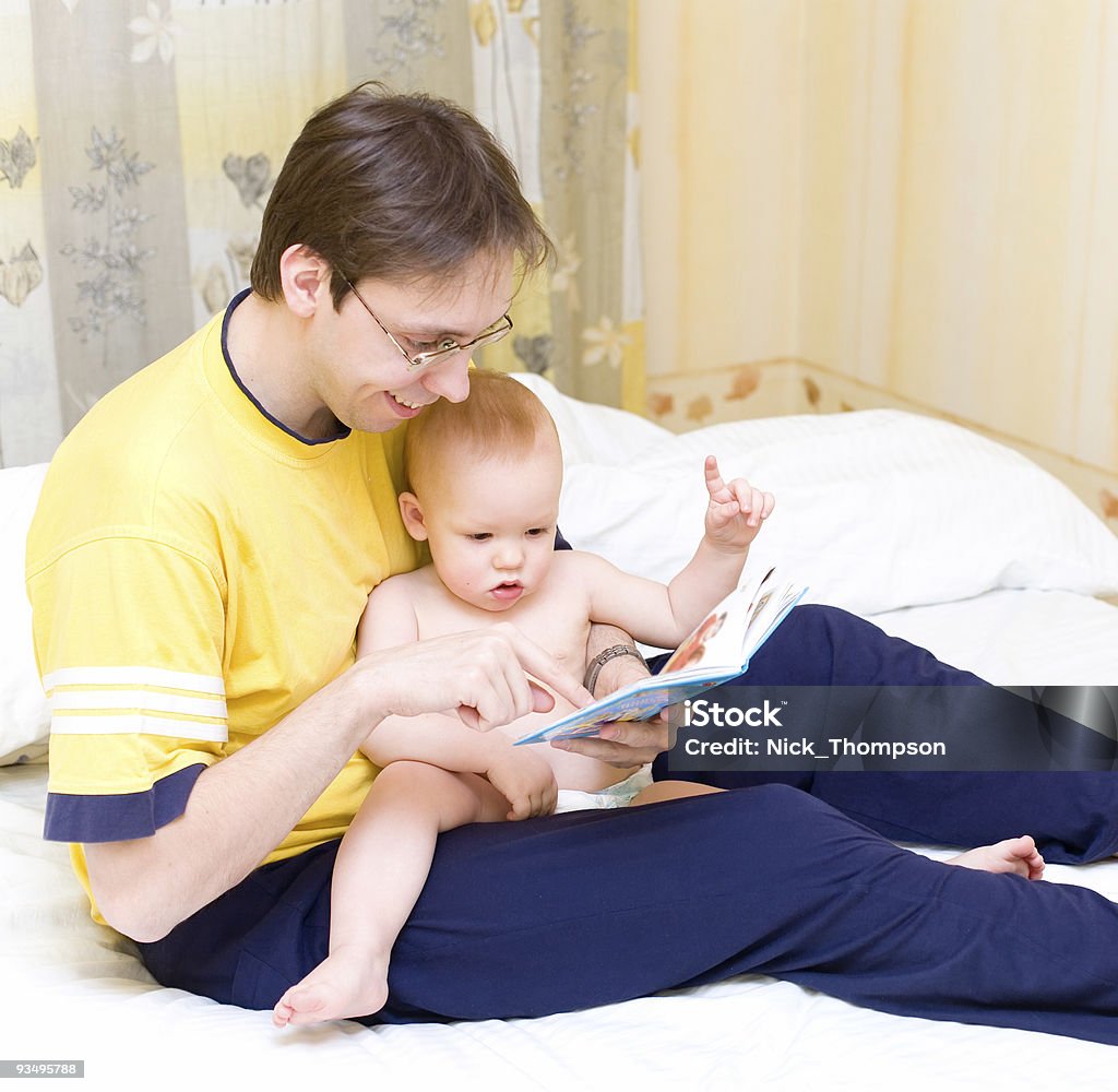 Father reading to his son  A Helping Hand Stock Photo