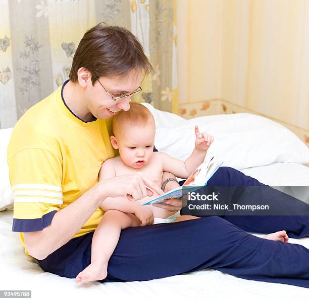Father Reading To His Son Stock Photo - Download Image Now - A Helping Hand, Adult, Aiming