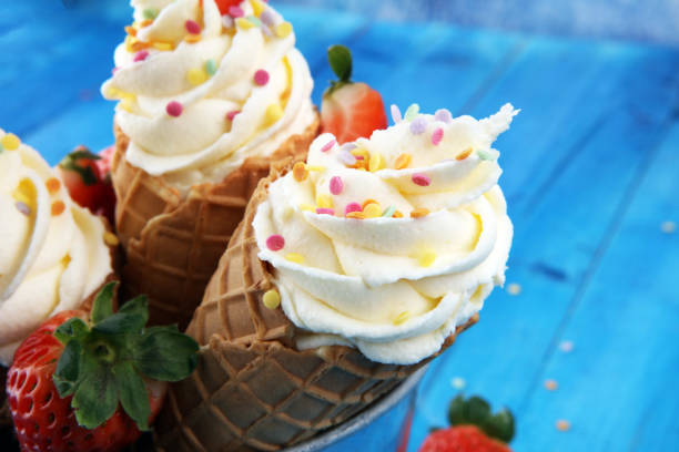 istock Vanilla frozen yogurt or soft ice cream in waffle cone. 934977764