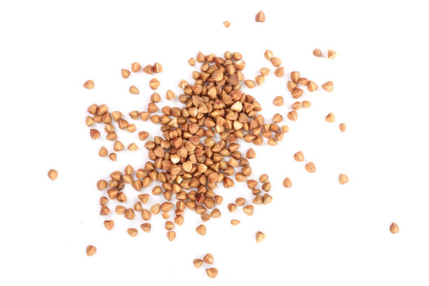 istock buckwheat grain isolated on white background close up. Top view 934978754