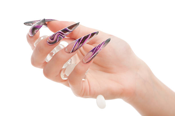 Hand with multicolor nails polish on white background