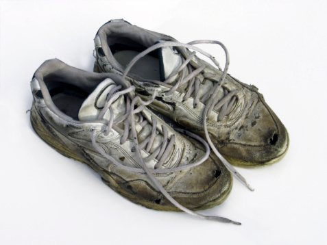 old shoes that are worn and dirty.