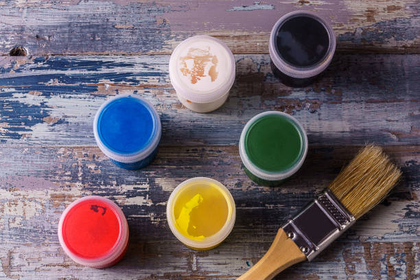 istock Top view of color paints with paintbrush. 935002502