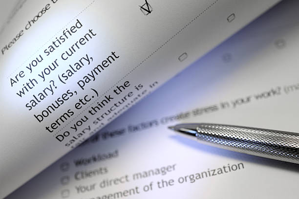 Employee survey being filled out stock photo
