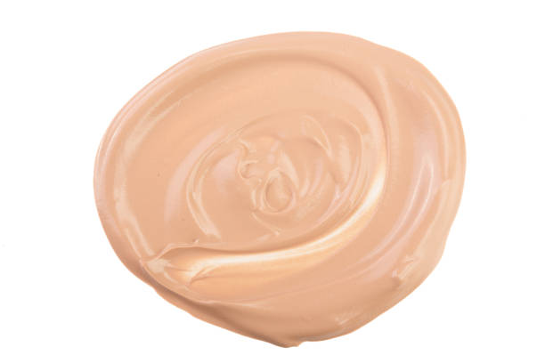 istock Beige liquid foundation makeup isolated on white background 935018790