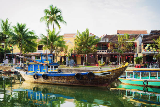 Ship at Thu Bon River in Hoi An Vietnam Ship at the Embankment of Thu Bon River in Hoi An, Vietnam thu bon river stock pictures, royalty-free photos & images