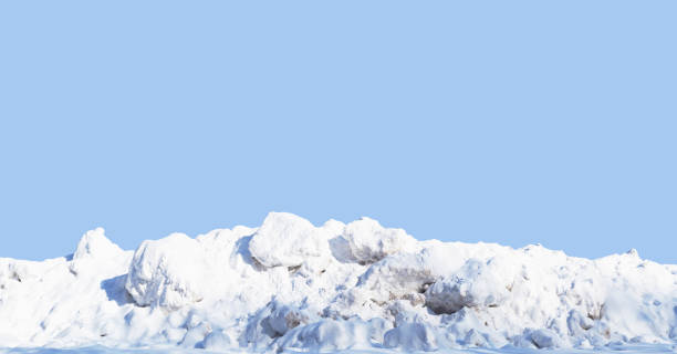 Snow pile, hill. Large snow drift isolated on a blue sky background, close-up. Panoramic view. Winter in the mountains. Hummock, avalanche