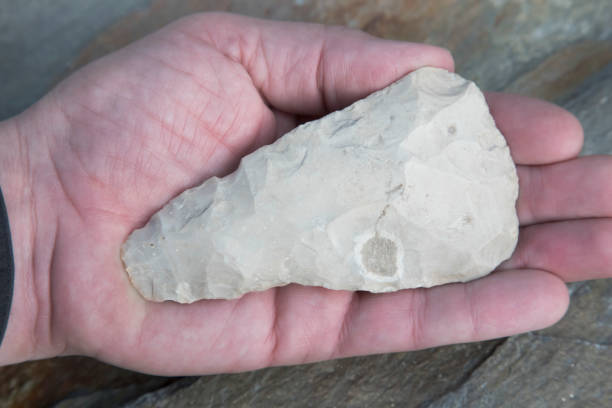 istock Mayan Weapon - Tomahawk Arrowhead Artifact in Hand 935028678