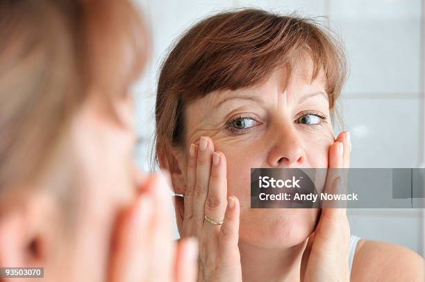 Face In The Mirror Stock Photo - Download Image Now - Facial Massage, 45-49 Years, Adult