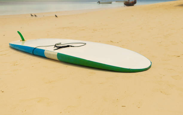 istock Surfboard in the sand at the beach. Summer background 935032180