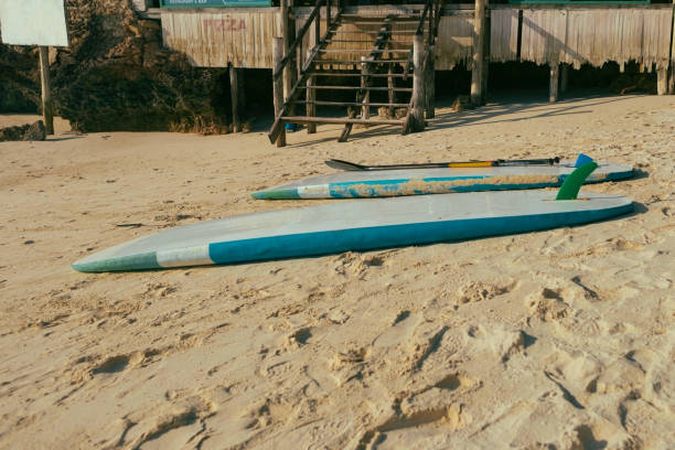 istock Summer background. Two surfboard in the sand beach at sunset or sunrise 935032208