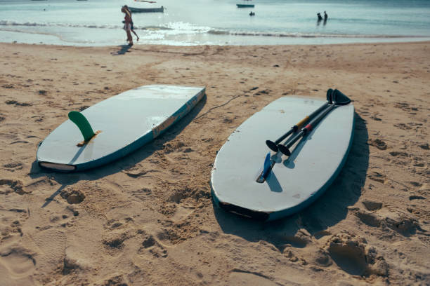 istock Two surfboard in the sand beach at sunset or sunrise. Summer background 935032268