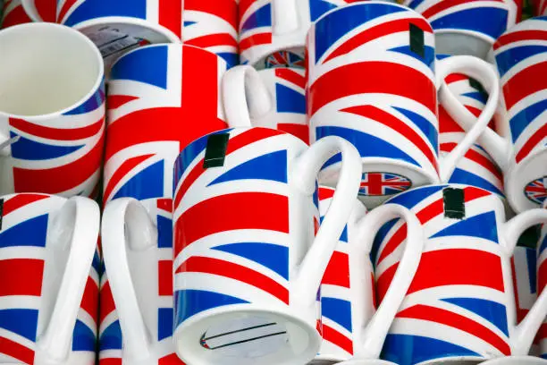 Photo of United Kingdom flag souvenir mugs on display at Camden market