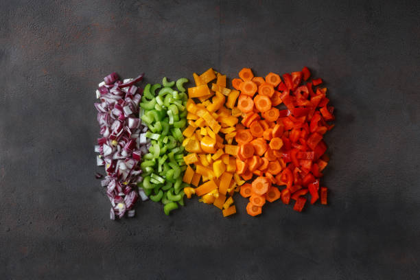 istock Chopped fresh vegetables on dark background, top view 935035198