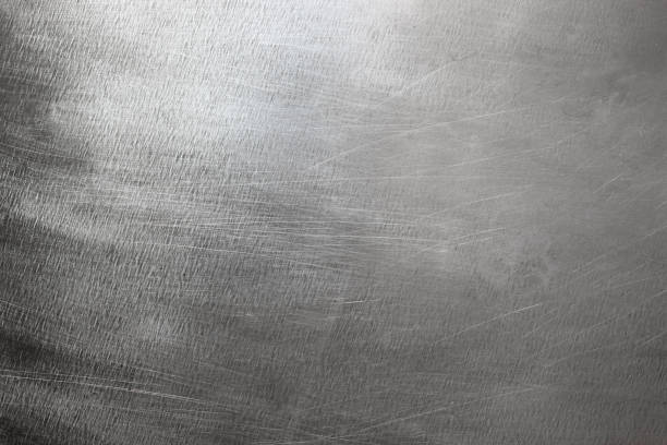 istock Silver metal background, steel sheet with a brush pattern 935046672
