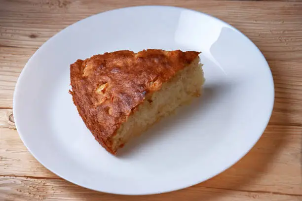 Photo of Fresh Homemade Apple Pie with a Flakey Crust on white plate