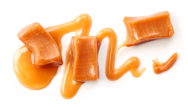 istock pieces of caramel isolated on white background 935052468